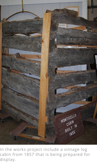 In the works project include a vintage log cabin from 1857 that is being prepared for display.